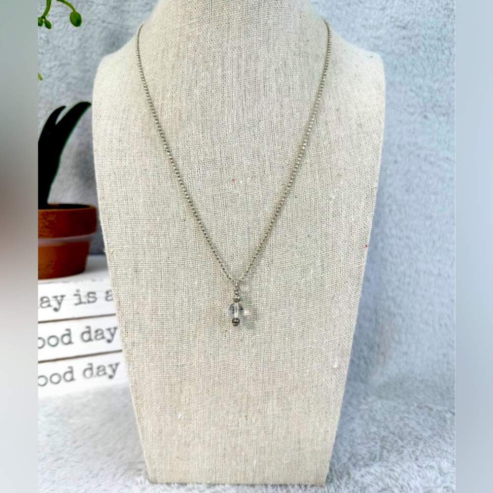 Glossy, blue hue stone on 19" silver chain